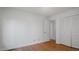 This bedroom includes hardwood floors and a closet with white doors at 110 Omega Rd, Henderson, NC 27536