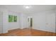 Bedroom with hardwood floors, multiple closets, and natural light at 110 Omega Rd, Henderson, NC 27536