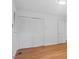 This bedroom features hardwood floors and closet with white doors at 110 Omega Rd, Henderson, NC 27536