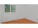 This bedroom provides hardwood floors and a window for natural light at 110 Omega Rd, Henderson, NC 27536