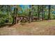 Ranch-style brick house with trees on a partially shaded lot at 110 Omega Rd, Henderson, NC 27536
