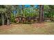 Charming brick home surrounded by mature trees and landscaping at 110 Omega Rd, Henderson, NC 27536
