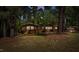Ranch-style brick home with a two-car garage and established trees at 110 Omega Rd, Henderson, NC 27536