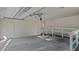 Bright garage features a ramp, high ceilings, and ample space for parking and storage at 110 Omega Rd, Henderson, NC 27536