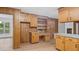 Functional kitchen with wood cabinets and desk space at 110 Omega Rd, Henderson, NC 27536