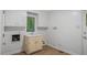 Functional laundry room featuring a sink, storage cabinets, and convenient access to the exterior at 110 Omega Rd, Henderson, NC 27536