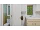 Charming laundry room with tiled accents, toilet, sink, and storage, providing a practical space at 110 Omega Rd, Henderson, NC 27536