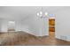 Spacious living room with hardwood floors and a view into the adjacent kitchen at 110 Omega Rd, Henderson, NC 27536