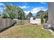Spacious backyard featuring green grass and a storage shed at 121 Drumbuie Pl, Garner, NC 27529