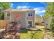 A cozy backyard featuring a hammock, a Japanese maple tree, a wood pile and a well-maintained lawn at 121 Drumbuie Pl, Garner, NC 27529