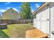 Backyard featuring a wooden storage shed with ramp and fenced perimeter at 121 Drumbuie Pl, Garner, NC 27529