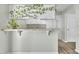 Kitchen showcasing white cabinets, modern appliances and bar area at 121 Drumbuie Pl, Garner, NC 27529