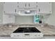 Kitchen featuring white cabinets, modern appliances, and granite countertops at 121 Drumbuie Pl, Garner, NC 27529