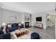 Inviting living room showcasing modern decor, a cozy fireplace, and stylish furnishings at 121 Drumbuie Pl, Garner, NC 27529