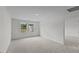 Spacious room with neutral carpeting and ample natural light from windows at 130 N Keatts Winner Ct, Wilson's Mills, NC 27520