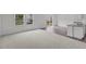 Spacious living area showcasing an open floor plan with carpet and hardwood flooring at 130 N Keatts Winner Ct, Wilson's Mills, NC 27520