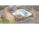 Aerial shot showcases the community pool, playground, and clubhouse amenities at 130 Stromness Path, Clayton, NC 27527
