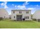 Well-maintained backyard with a screened-in porch and a fenced perimeter at 130 Stromness Path, Clayton, NC 27527