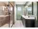 Bathroom featuring a glass enclosed shower, double sinks, and modern finishes at 130 Stromness Path, Clayton, NC 27527