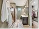 Bathroom with walk-in shower, vanity, and direct access to walk-in closet at 130 Stromness Path, Clayton, NC 27527