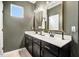 Bathroom with double vanity, decorative mirrors, and gray wall color at 130 Stromness Path, Clayton, NC 27527