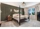 Cozy bedroom with decorative wall, four-poster bed, and neutral carpet at 130 Stromness Path, Clayton, NC 27527