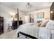 Bedroom featuring wood floors, neutral walls, and a decorative fireplace at 130 Stromness Path, Clayton, NC 27527