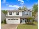 Inviting home with a two-car garage and a beautiful lawn, offering a blend of comfort and curb appeal at 130 Stromness Path, Clayton, NC 27527