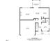 Layout of the first floor showing the living room, dining area, kitchen, and garage at 130 Stromness Path, Clayton, NC 27527