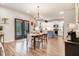 Open-concept kitchen featuring white cabinets, a blue island, and stainless steel appliances at 130 Stromness Path, Clayton, NC 27527