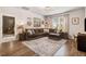 Spacious living area featuring a sectional sofa, a window, and decor at 130 Stromness Path, Clayton, NC 27527