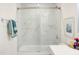 Bright bathroom featuring marble tiled shower, toilet and glass shower door at 1309 Hudson Ave # D1, Durham, NC 27705