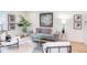 Cozy living room showcasing a comfortable gray sofa, modern art, and stylish accents at 1309 Hudson Ave # D1, Durham, NC 27705