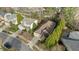 Aerial view showcasing a home with a manicured front lawn and mature trees in a nice neighborhood at 1320 Heritage Hills Way, Wake Forest, NC 27587