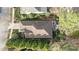 Aerial view of the property, showcasing the roof, landscaping, and outdoor patio area at 1320 Heritage Hills Way, Wake Forest, NC 27587