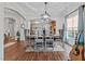 Elegant dining room with tray ceilings, an ornamental light fixture, and an archway to the kitchen at 1320 Heritage Hills Way, Wake Forest, NC 27587