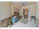 Cozy front porch with comfortable bench seating, stone accents, and a 'Welcome' mat at 1320 Heritage Hills Way, Wake Forest, NC 27587