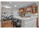 Open-concept kitchen with a large island, modern appliances, and hardwood floors at 1320 Heritage Hills Way, Wake Forest, NC 27587