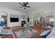 Comfortable living room with a fireplace, built-in shelving, and seamless access to the dining area at 1320 Heritage Hills Way, Wake Forest, NC 27587