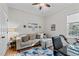 Home office area with a comfortable sofa, desk, and workout equipment at 1320 Heritage Hills Way, Wake Forest, NC 27587