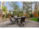 Outdoor patio with stone pavers featuring a dining table and chairs surrounded by landscaping at 1320 Heritage Hills Way, Wake Forest, NC 27587