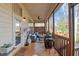 Inviting screened porch featuring an outdoor ceiling fan, a bar, and comfortable seating at 1320 Heritage Hills Way, Wake Forest, NC 27587