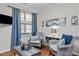 Comfortable sitting room with plush chairs, a decorative coffee table, and natural light at 1320 Heritage Hills Way, Wake Forest, NC 27587