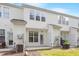 Rear view of home featuring back patio, lawn, and exterior access for added space at 135 Cedar Elm Rd, Durham, NC 27713