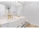 Modern bathroom with a double vanity, white countertops, gold fixtures, and a large mirror for a bright space at 135 Cedar Elm Rd, Durham, NC 27713