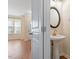 Stylish half bathroom featuring a pedestal sink and modern fixtures at 135 Cedar Elm Rd, Durham, NC 27713