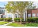 Inviting townhome with lush landscaping and a quaint front porch at 135 Cedar Elm Rd, Durham, NC 27713