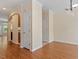 Open-concept living space with wood floors and arched doorway at 135 Cedar Elm Rd, Durham, NC 27713