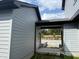 Backyard leading to the unfinished foundation of the unit, and gray siding at 14 Relaxing Way, Pittsboro, NC 27312