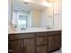 Bathroom featuring a large vanity with double sinks, ample storage, and a large mirror at 14 Relaxing Way, Pittsboro, NC 27312
